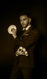 Magician with cards and balls